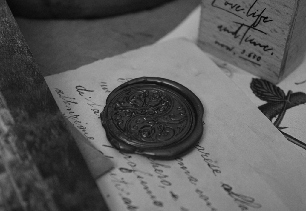 a closeup image of an old letter with wax seal representing the Delightful Signoffs post