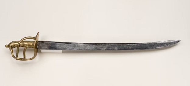 laid out on a plain white surface is cutlass, one of sword types