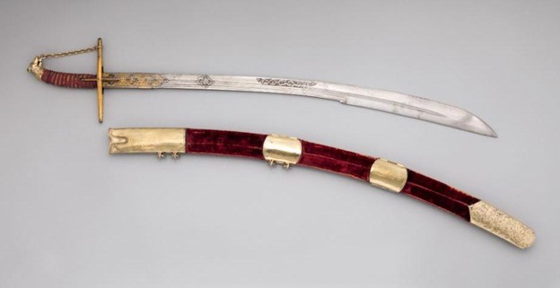 a sabre or saber with its sheath, one of the sword types